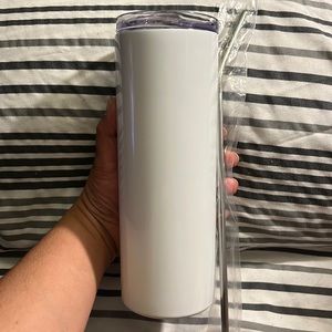 4 white tumblers with straws